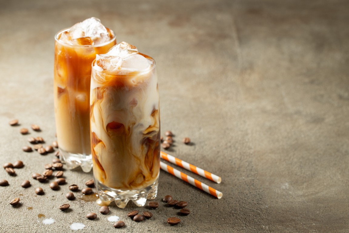 ice-coffee-in-a-tall-glass-with-cream-poured-over-2026-01-07-06-18-01-utc