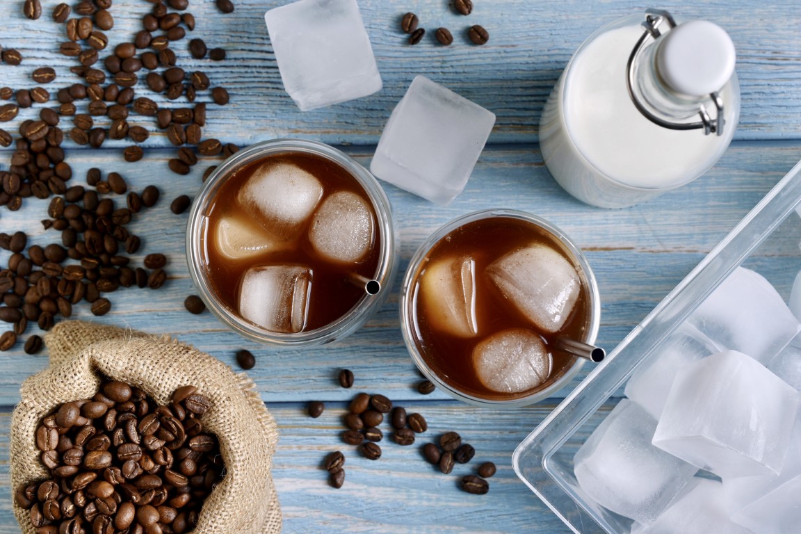 iced-coffee-and-coffee-beans-on-a-counter-2026-01-07-05-58-08-utc