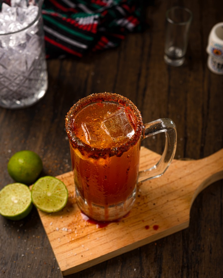 michelada-typical-mexican-cocktail-on-a-wooden-ta-2026-01-08-22-21-20-utc